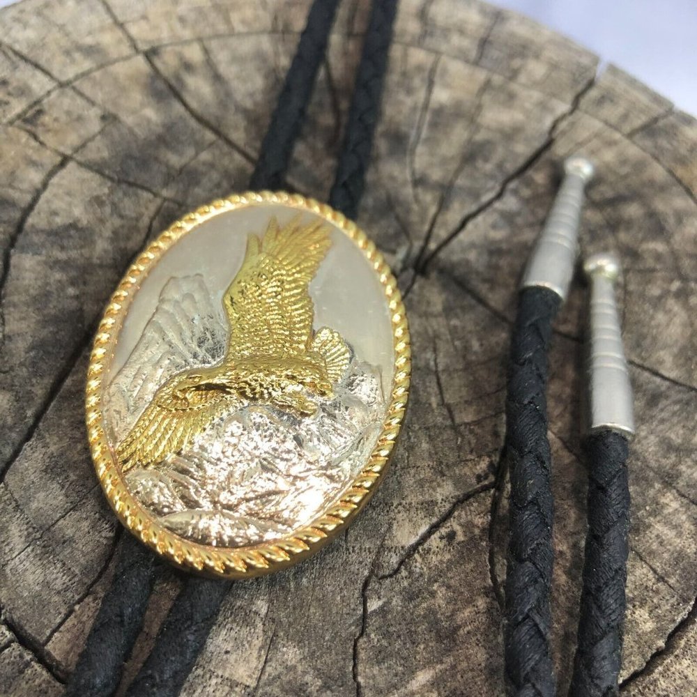 Vtg IVAN Signed American Eagle Silver Gold Bolo Tie Black Synthetic Braided Cord